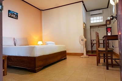 Air-con room on the yard side with access to the riverside and hammock garden