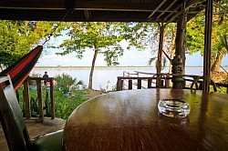 Balcony with hammock, table and chairs