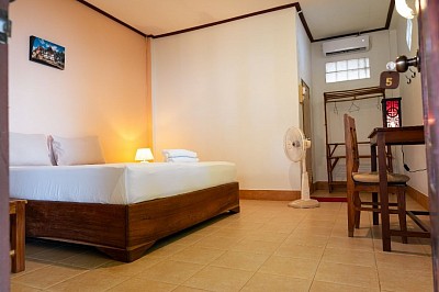 Air-con room on the yard side with access to the riverside and hammock garden