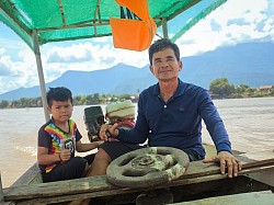 Boat crossing with Mr Vieng